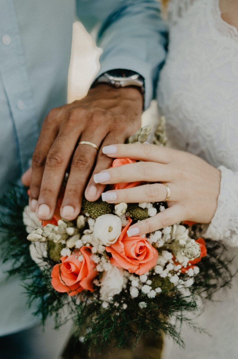 wedding rings on a newly wedded couple